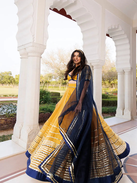 Sunset Gold Yellow and Navy Blue Lehenga Set RAGAVI