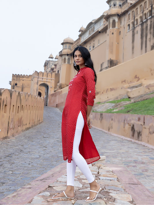 Model wearing Zoya Red Leheriya Kurta with white palazzos