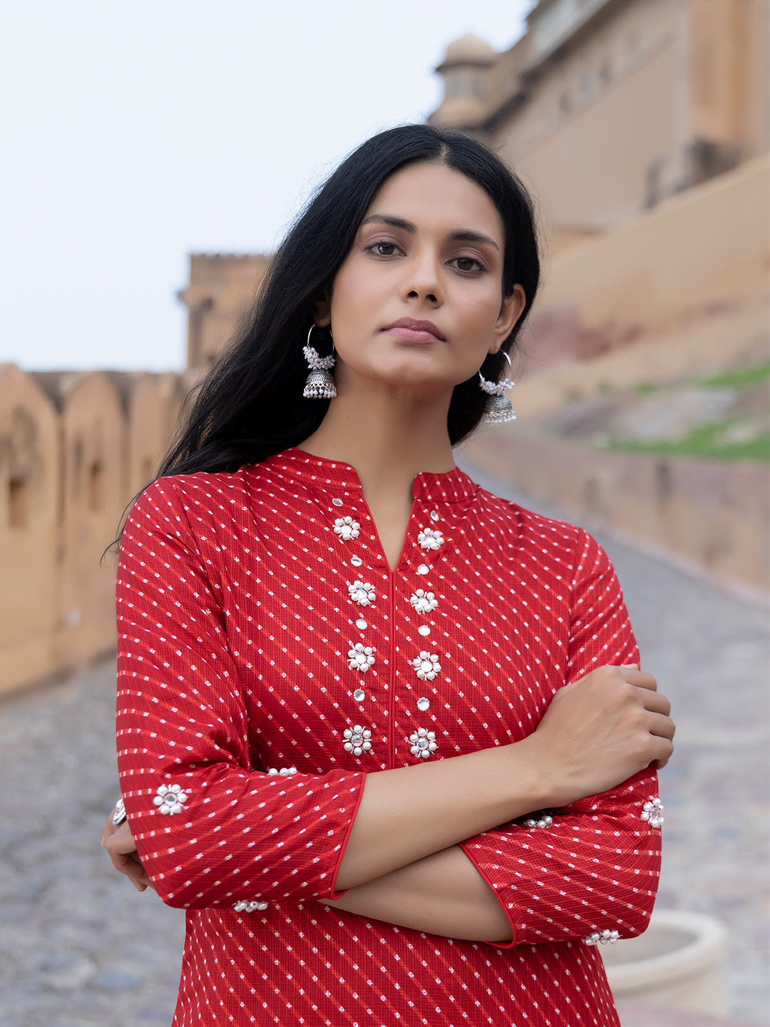 Close-up of red Leheriya print on cotton fabric of Zoya Kurta