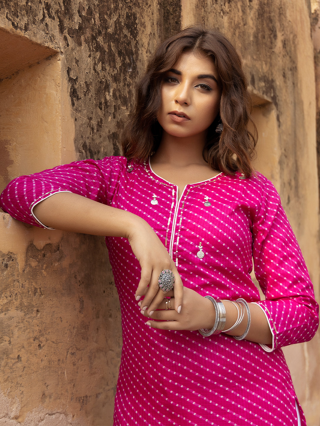 Close-up of V-neck and sleeve design on Pri Pink Leheriya Kurt